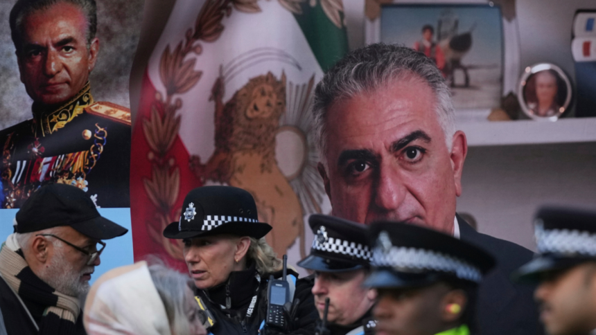 Police officers in uniform chatting in front of a large portrait and a Mexican flag backdrop.