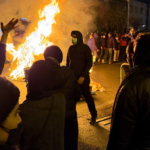 In this photo obtained by The Associated Press, Iranians attend an anti-government protest in Tehran, Iran, Friday, Jan. 9, 2026. (UGC via AP)